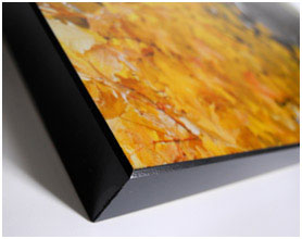An inkjet print on canvas is made using an image in digital format and printing it directly onto the canvas.